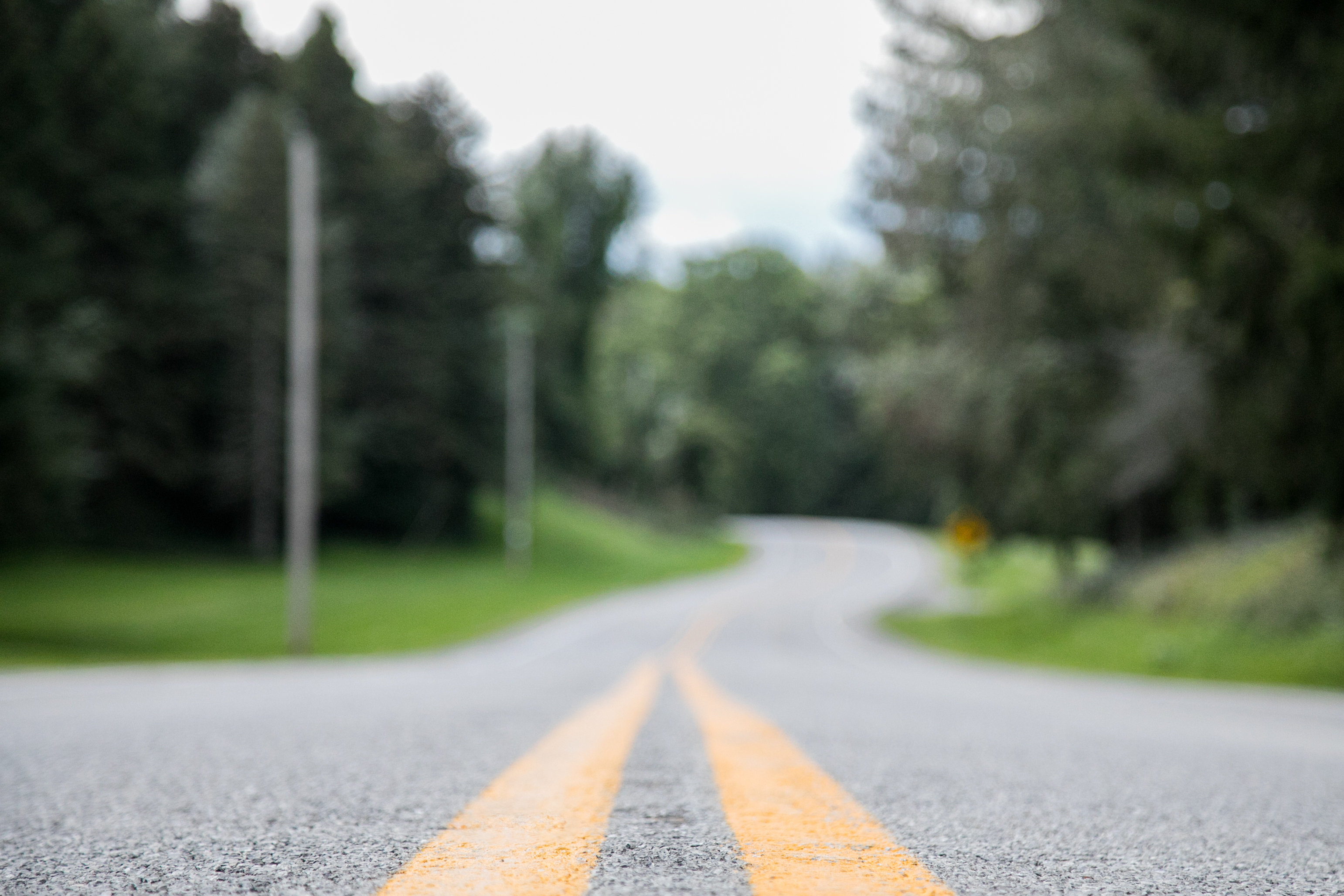 closeup-shot-empty-road-with-blurred-distance.jpg